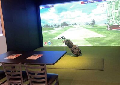 golf simulator with table and food menu